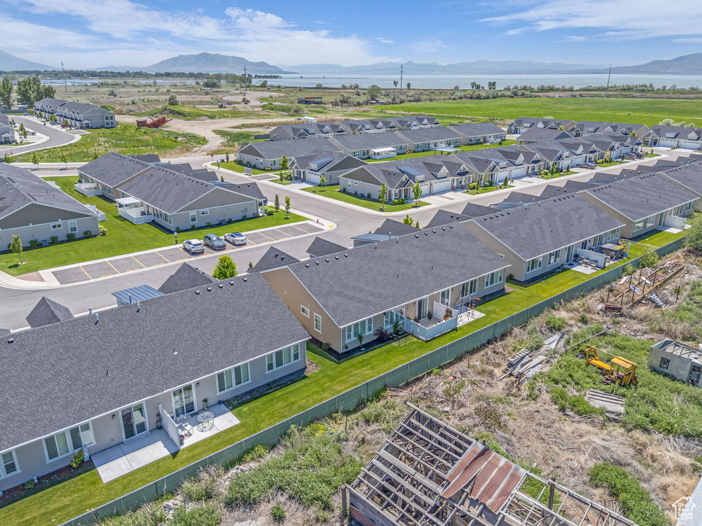 Aerial perspective of suburban area with a mountain backdrop