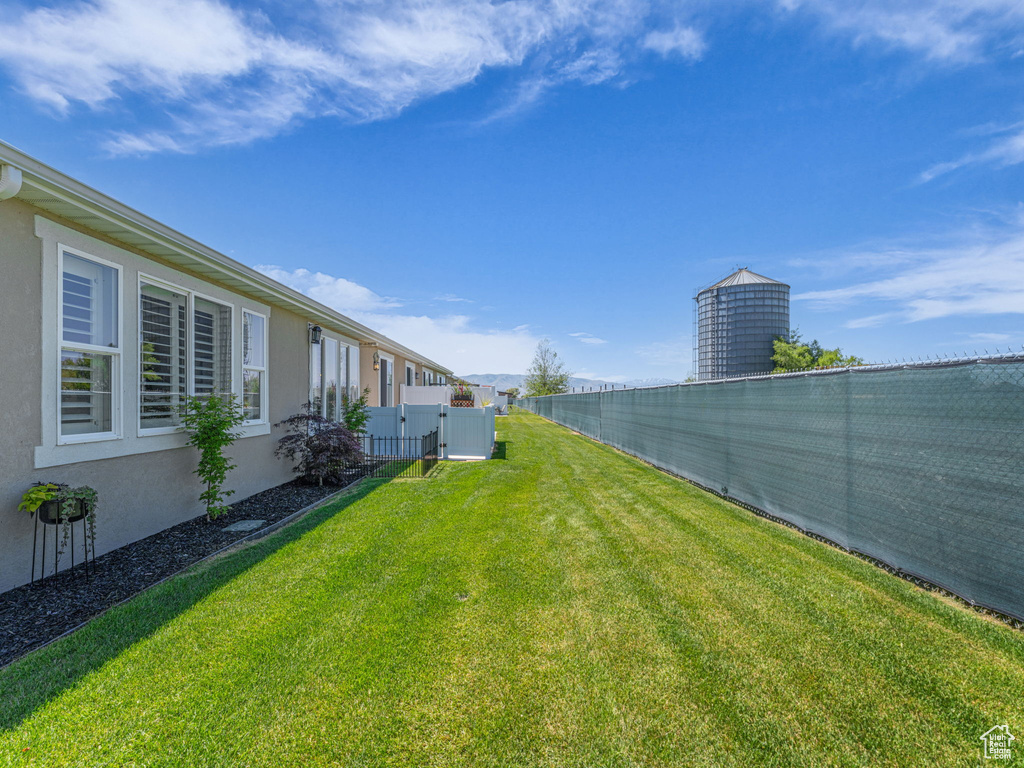View of yard featuring a gate
