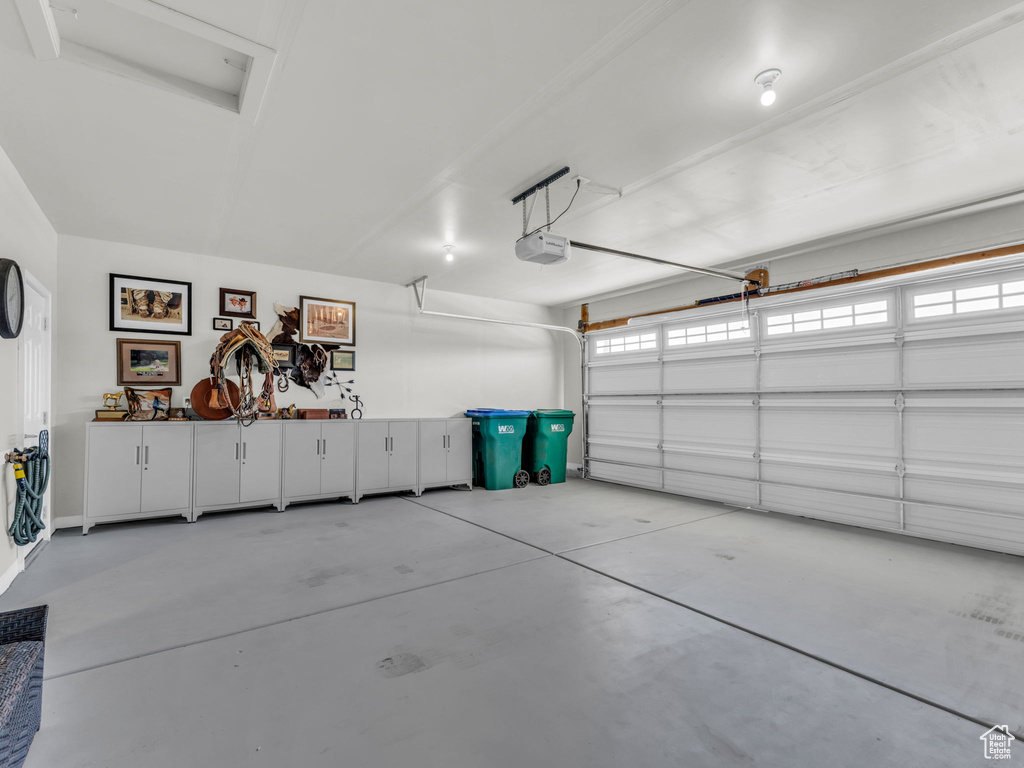 Garage featuring a garage door opener
