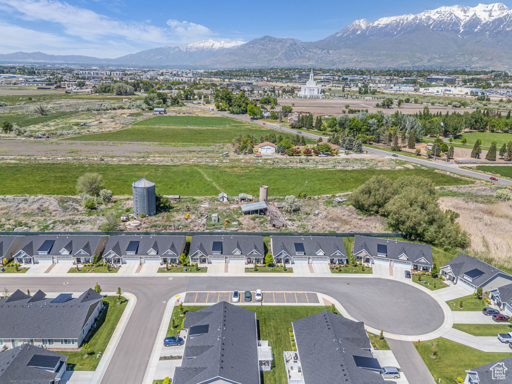 Aerial perspective of suburban area featuring a mountain backdrop