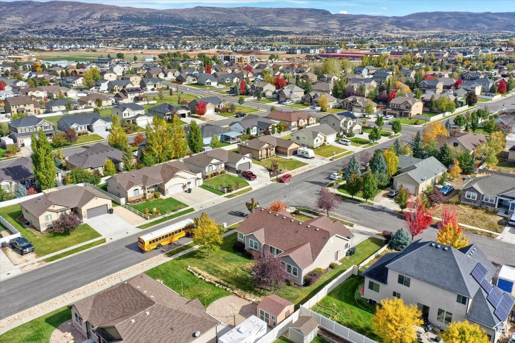 Aerial perspective of suburban area featuring a mountain backdrop
