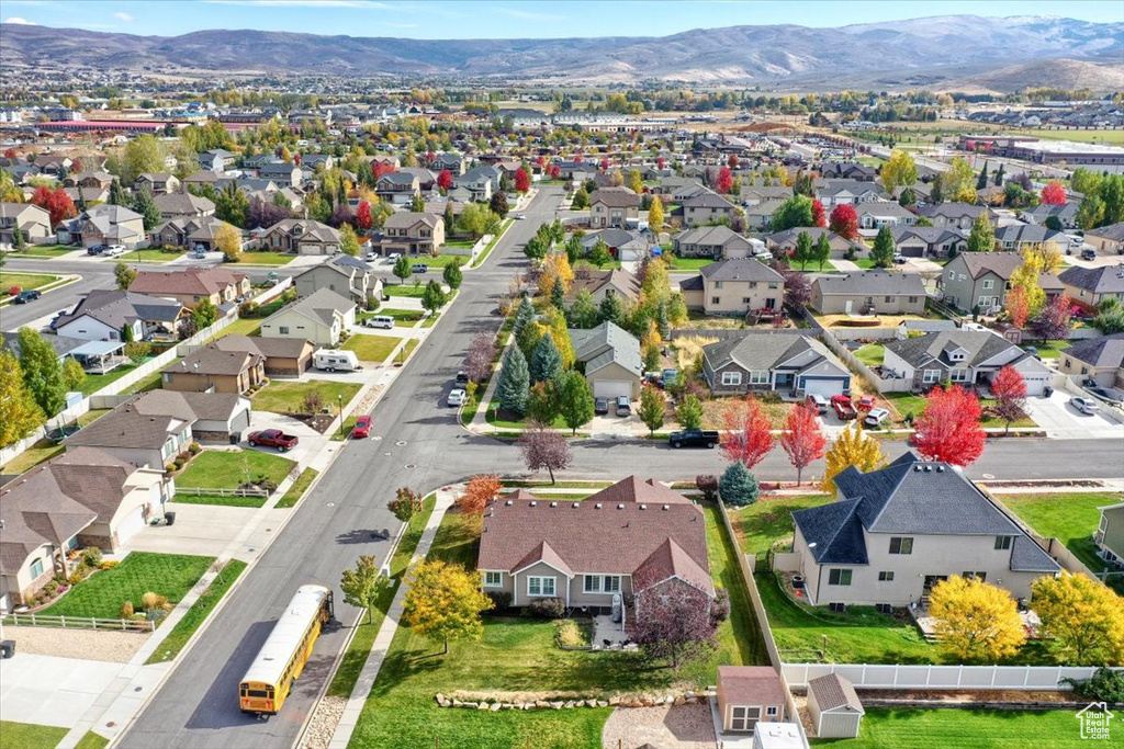 Aerial perspective of suburban area featuring a mountainous background