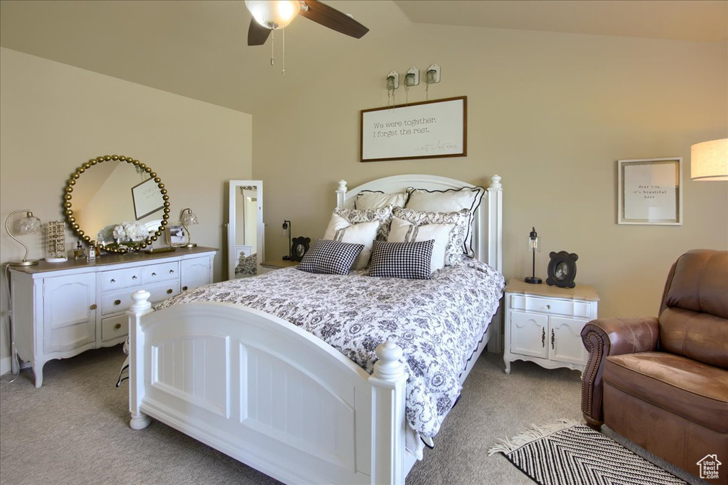 Bedroom with light carpet, lofted ceiling, and ceiling fan