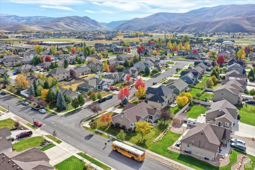 Aerial perspective of suburban area featuring a mountainous background