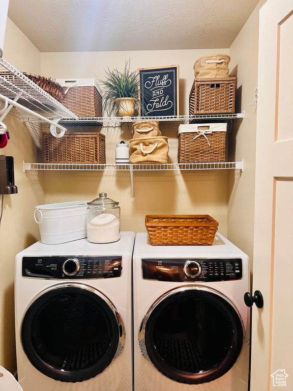 Clothes washing area featuring independent washer and dryer