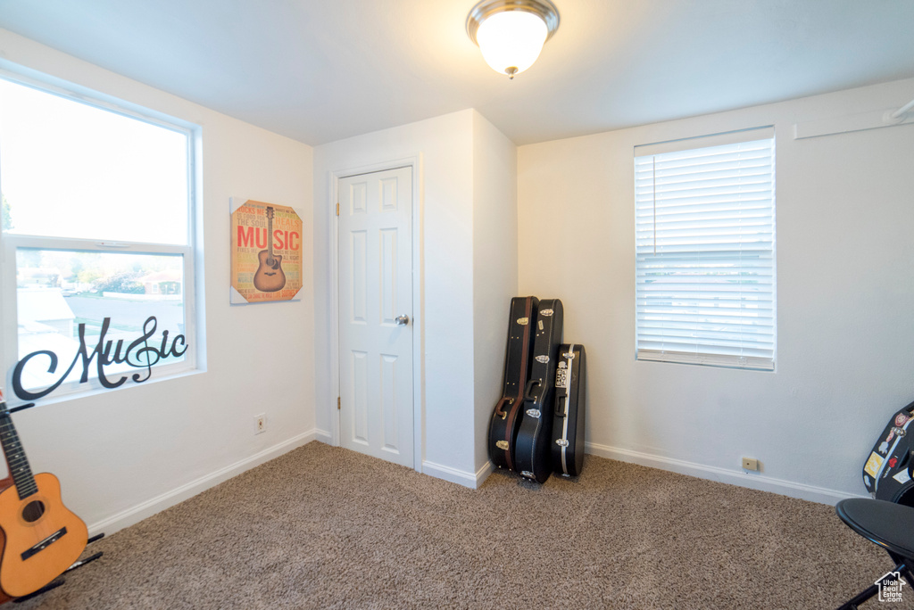 Misc room featuring carpet floors and baseboards