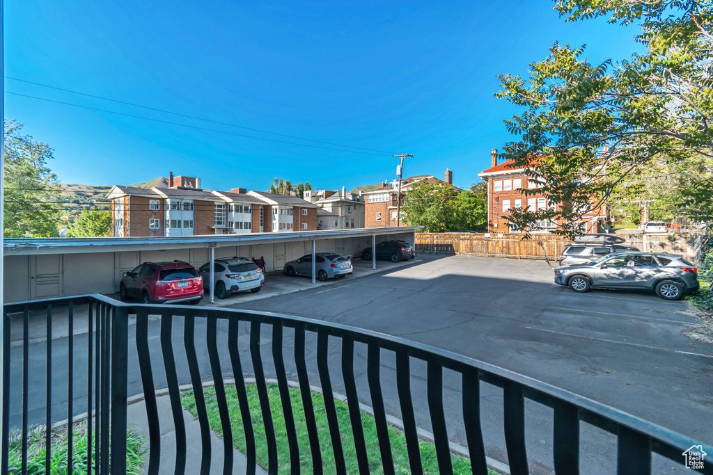 Exterior space with a parking lot and a residential view