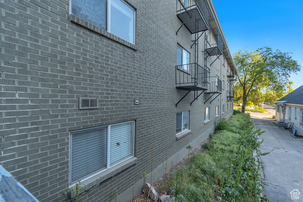 View of side of property with brick siding