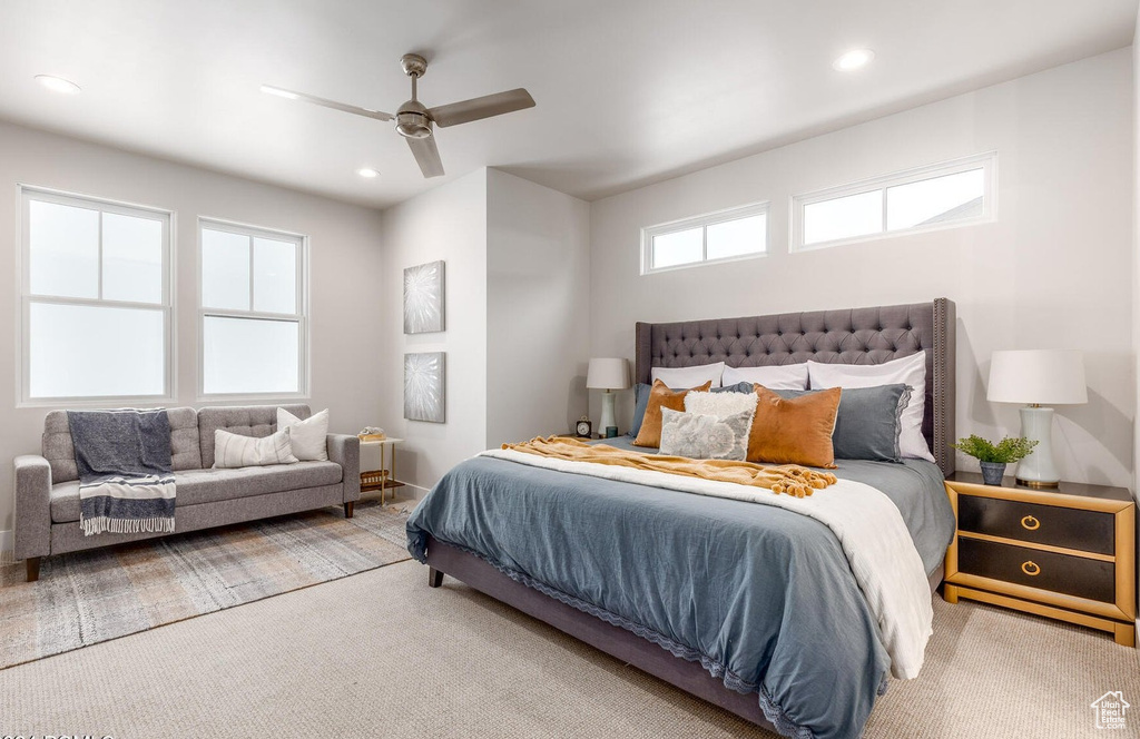 Carpeted bedroom featuring recessed lighting, a ceiling fan, and baseboards