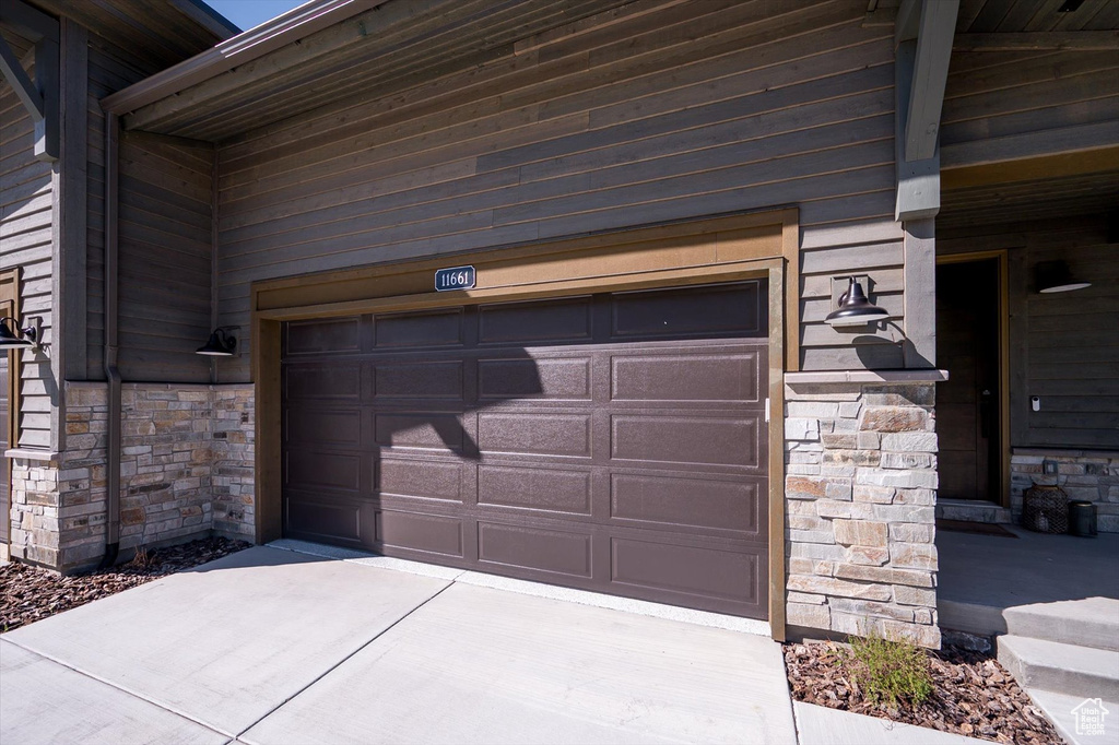 Garage with concrete driveway