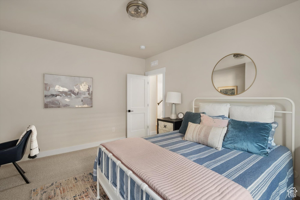 Bedroom with carpet and baseboards