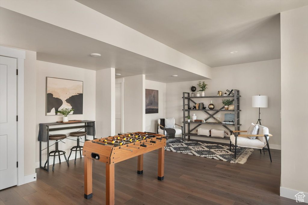 Game room featuring wood finished floors, baseboards, and recessed lighting