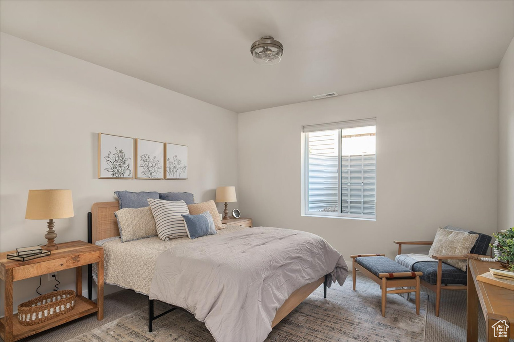 Bedroom with light carpet