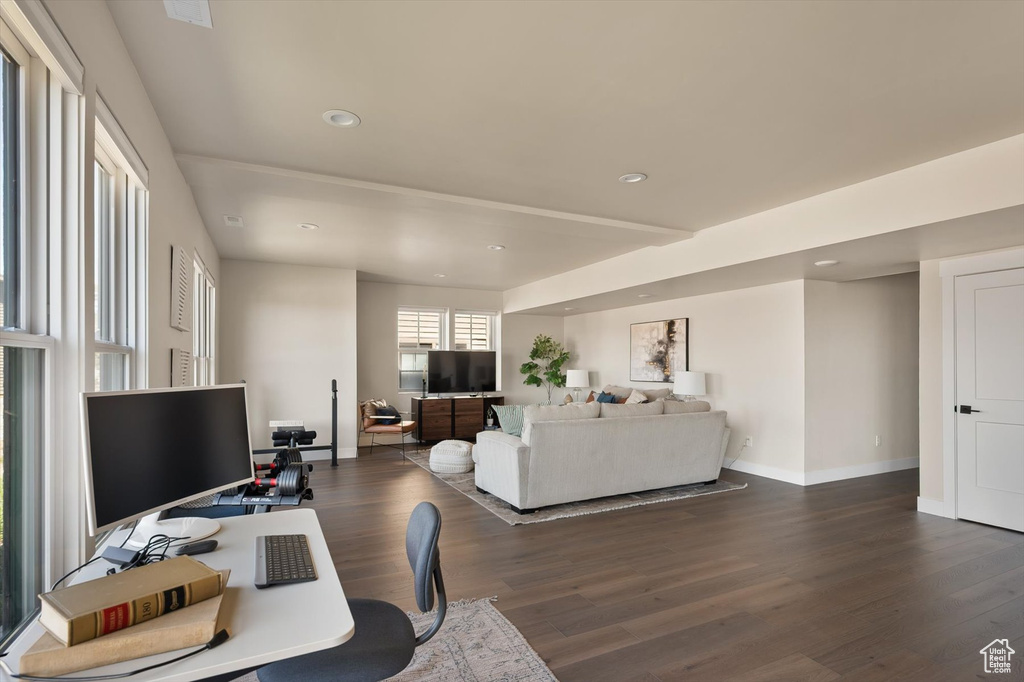 Home office with dark wood-style flooring, baseboards, and recessed lighting