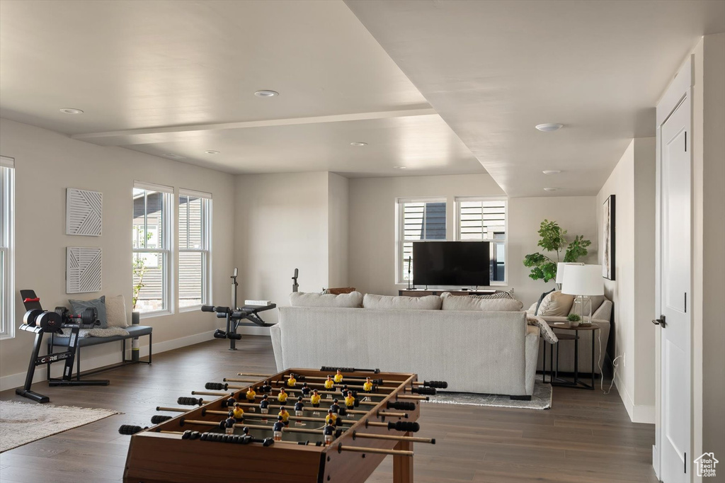 Recreation room featuring baseboards, dark wood-type flooring, and recessed lighting