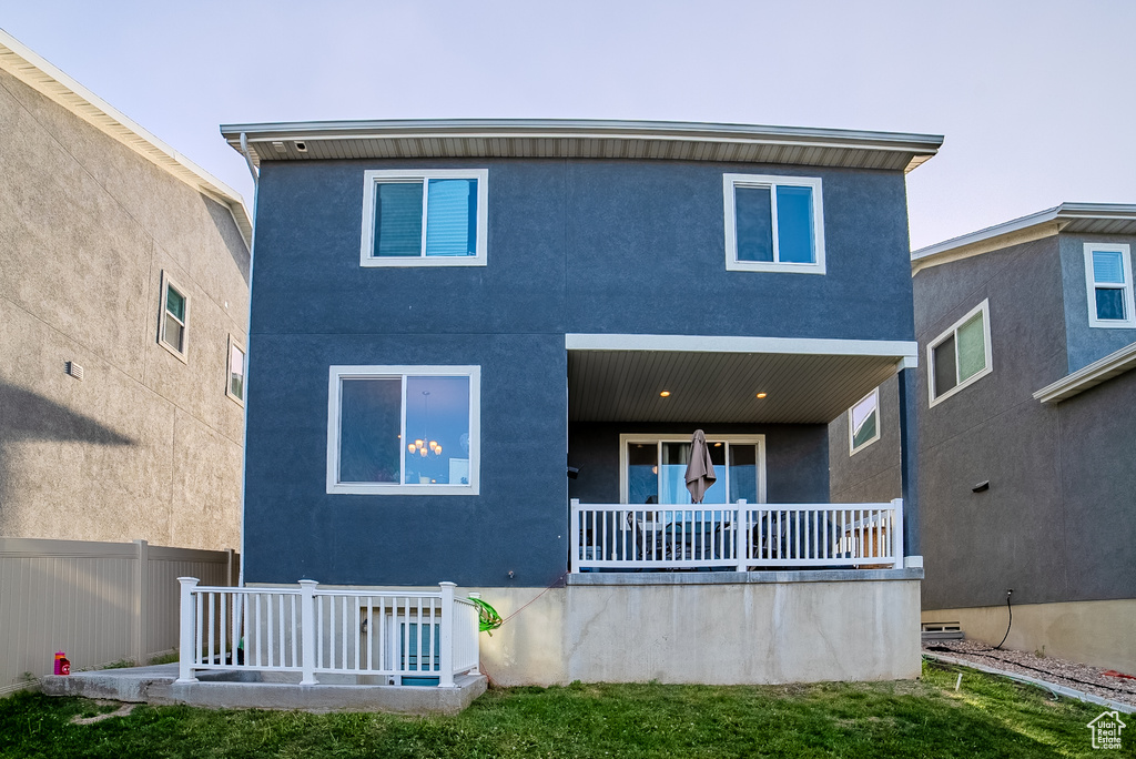 Rear view of house with stucco siding