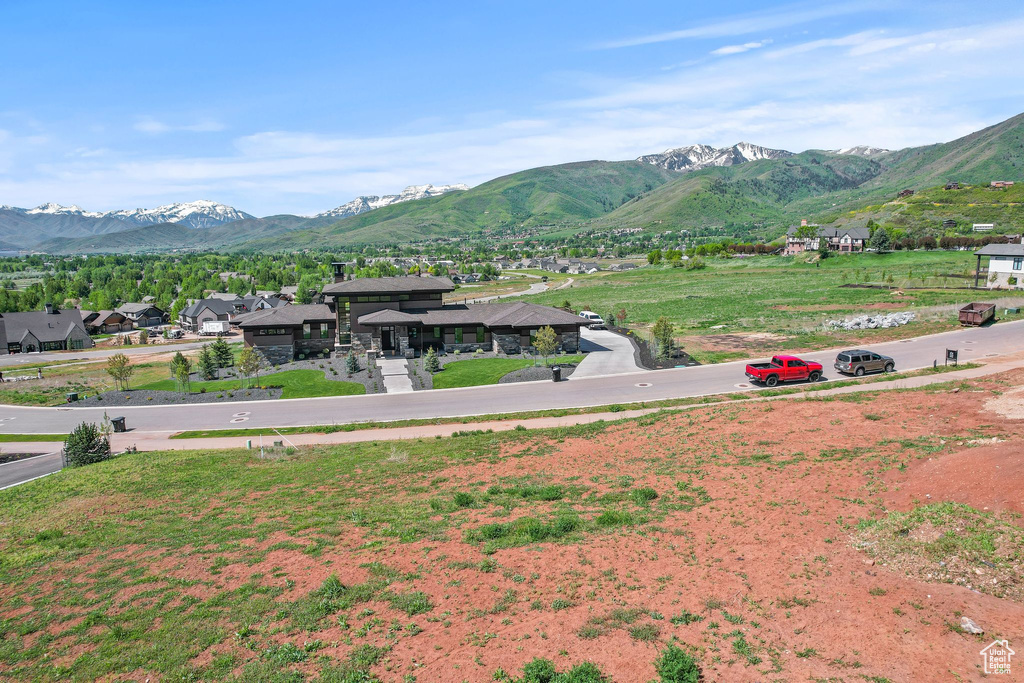 View of mountain backdrop featuring nearby suburban area