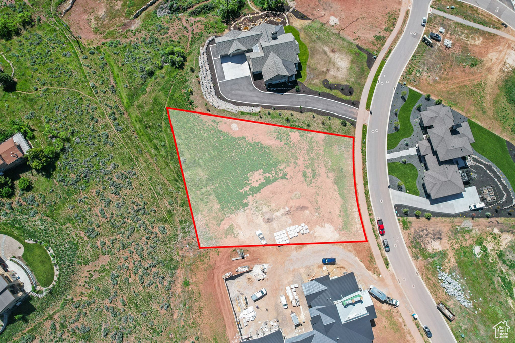 Aerial view of property and surrounding area with property parcel outlined