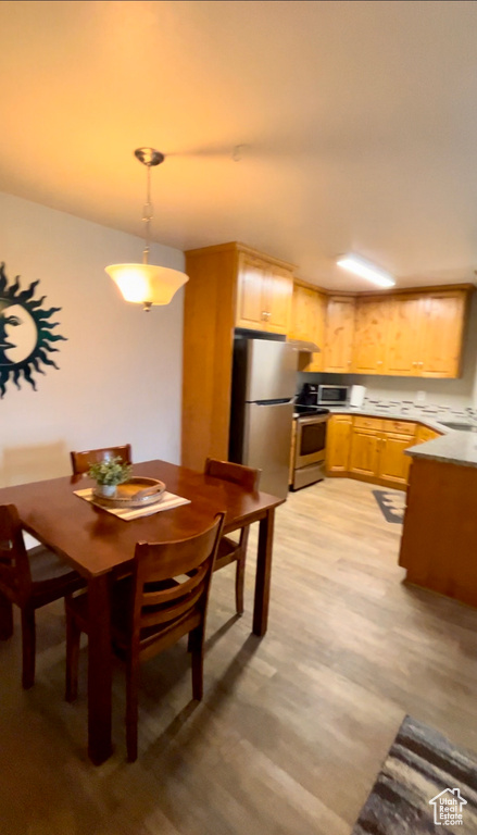 Dining room featuring light wood finished floors