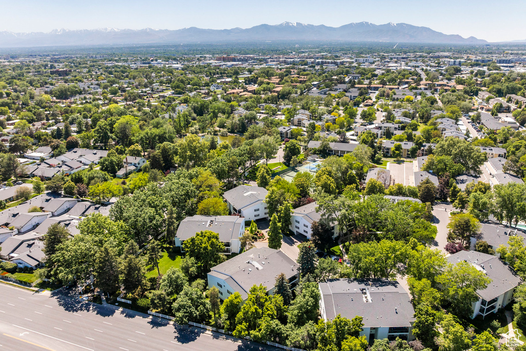Aerial perspective of suburban area featuring a mountainous background