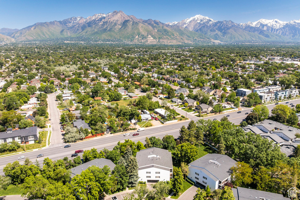 Aerial view of residential area with a mountainous background