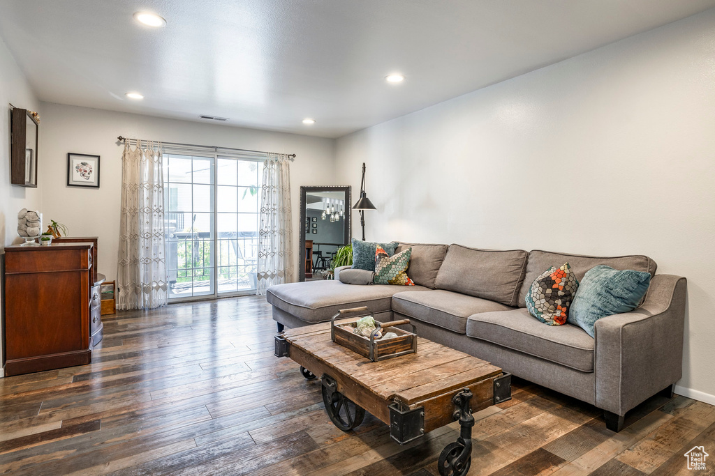 Living area featuring hardwood / wood-style flooring and recessed lighting