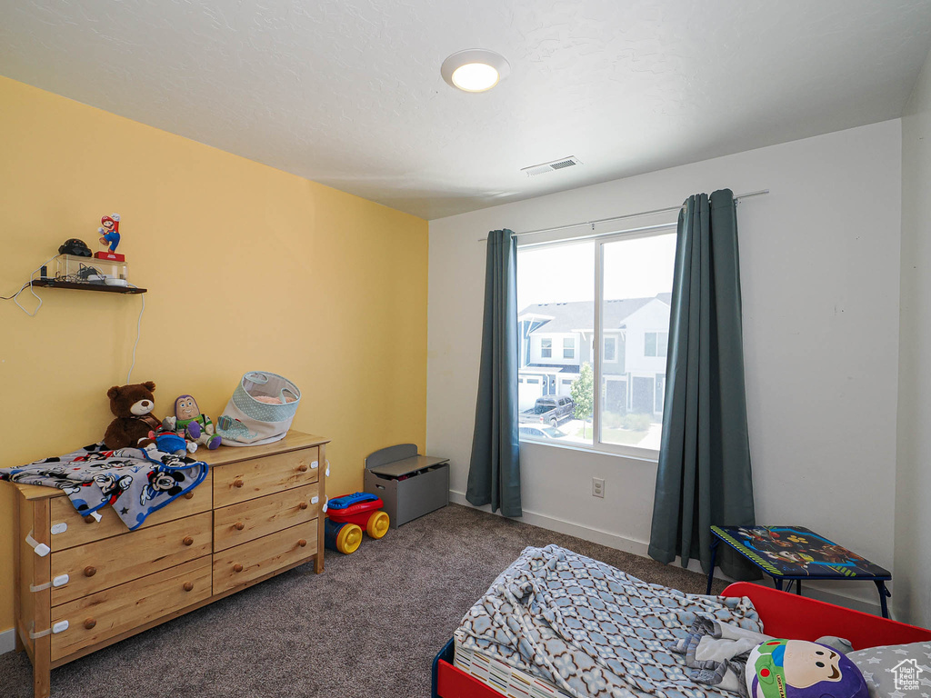 Bedroom with carpet and baseboards