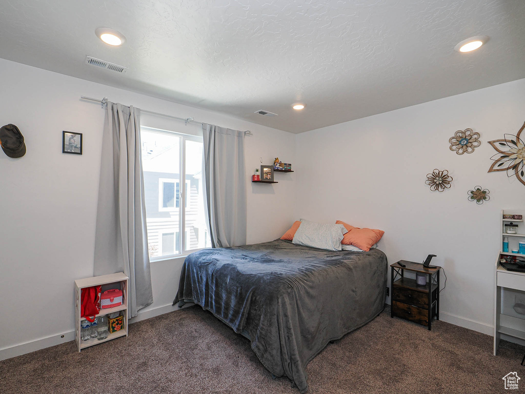 Bedroom with carpet floors, recessed lighting, and baseboards