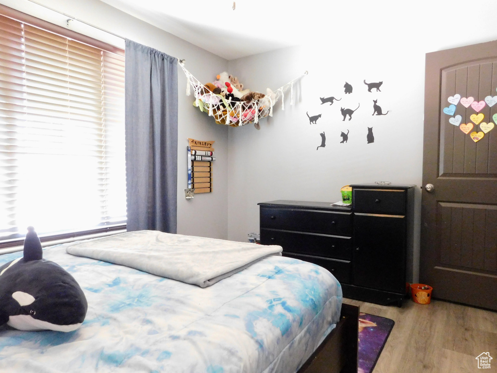 Bedroom with wood finished floors