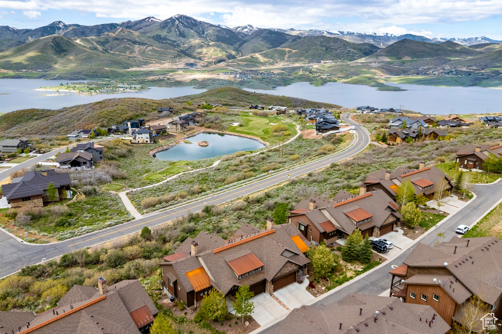 Aerial perspective of suburban area featuring a water and mountain view