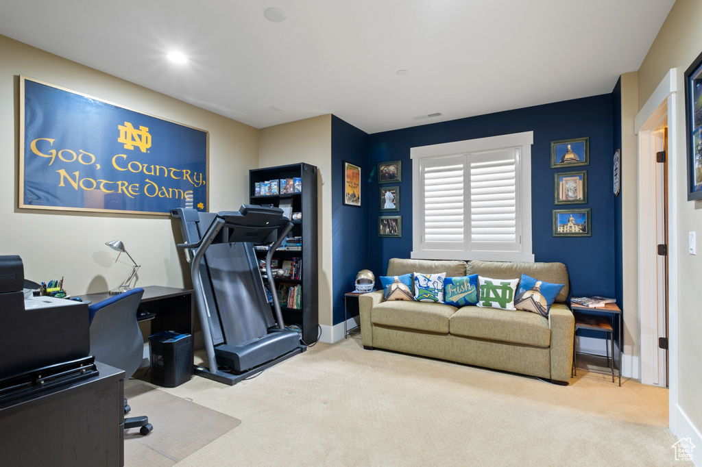 Office space with carpet flooring and baseboards