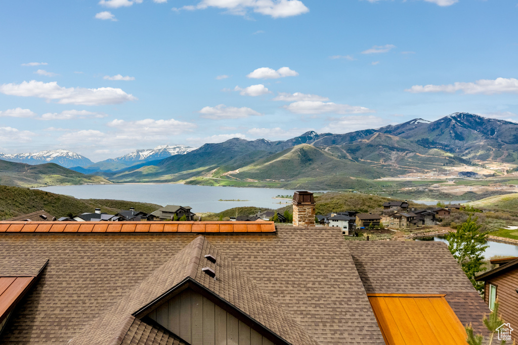 View of mountain backdrop featuring a large body of water