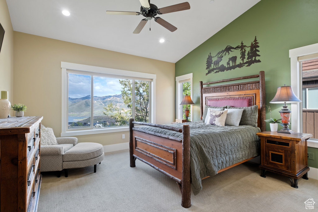 Bedroom with lofted ceiling, baseboards, light carpet, a mountain view, and recessed lighting