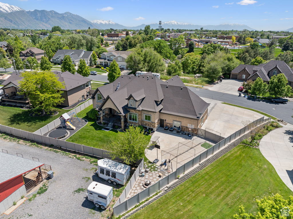 Aerial perspective of suburban area featuring a mountain backdrop