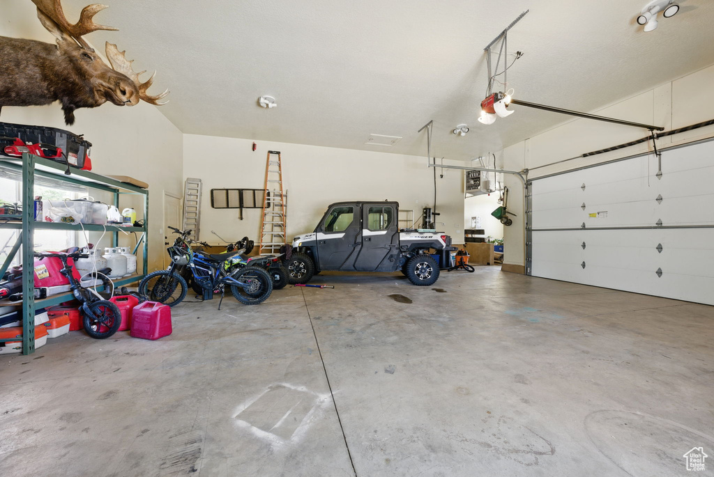 Garage featuring a garage door opener