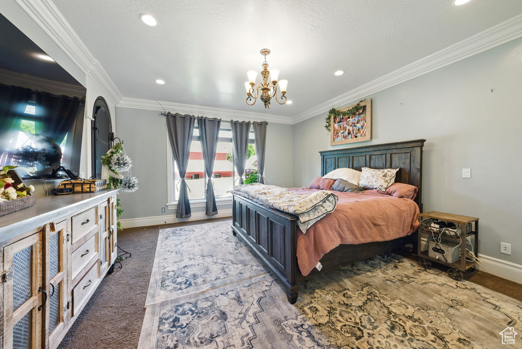 Bedroom featuring a chandelier, baseboards, ornamental molding, recessed lighting, and dark carpet