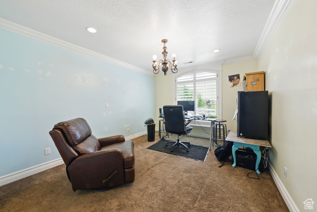 Office space with a chandelier, carpet floors, ornamental molding, a textured ceiling, and recessed lighting