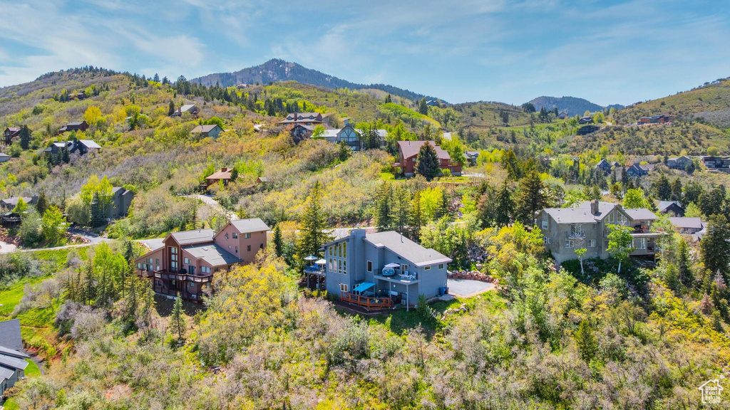 Aerial view of residential area featuring a mountainous background