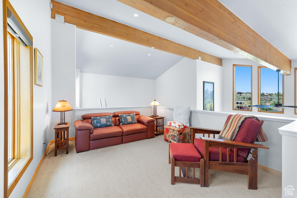 Living area with carpet floors, baseboards, and recessed lighting
