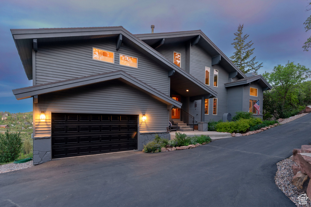 Contemporary house featuring a garage and driveway