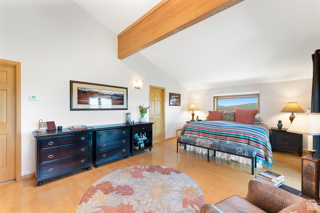 Bedroom with light wood-style floors and baseboards