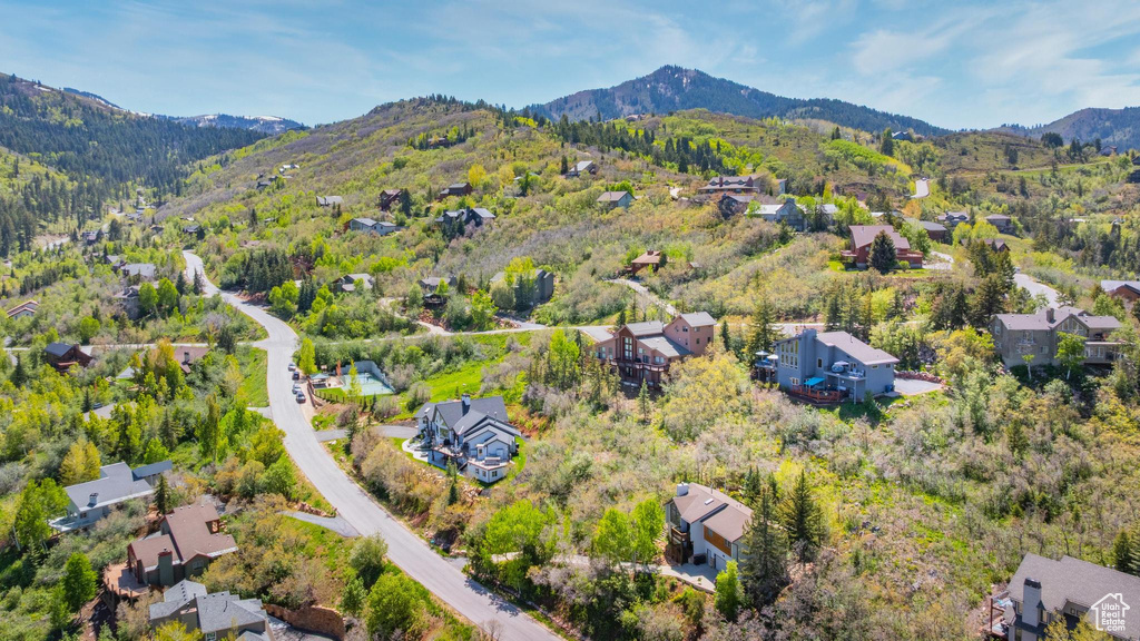 Aerial perspective of suburban area featuring a mountainous background