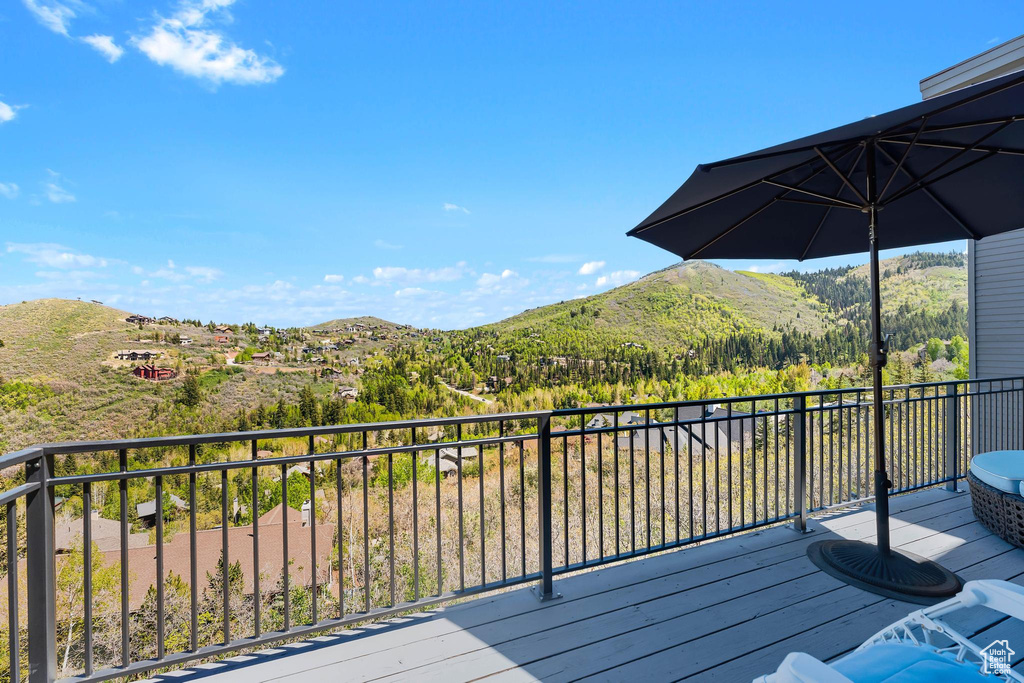 Wooden deck featuring a mountain view