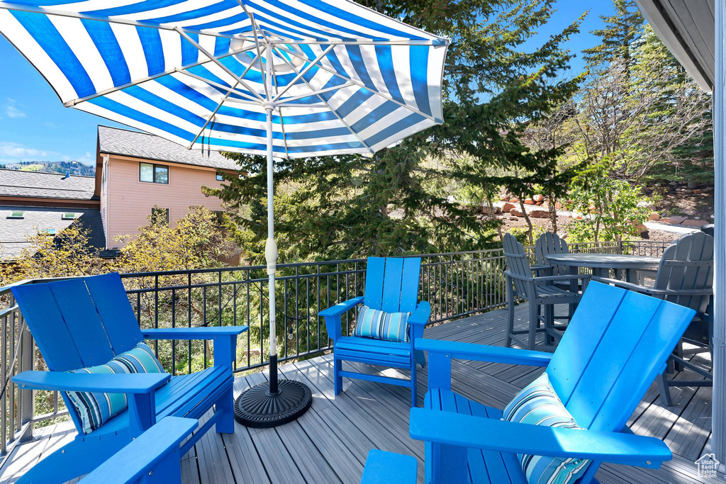 Wooden deck featuring outdoor dining space