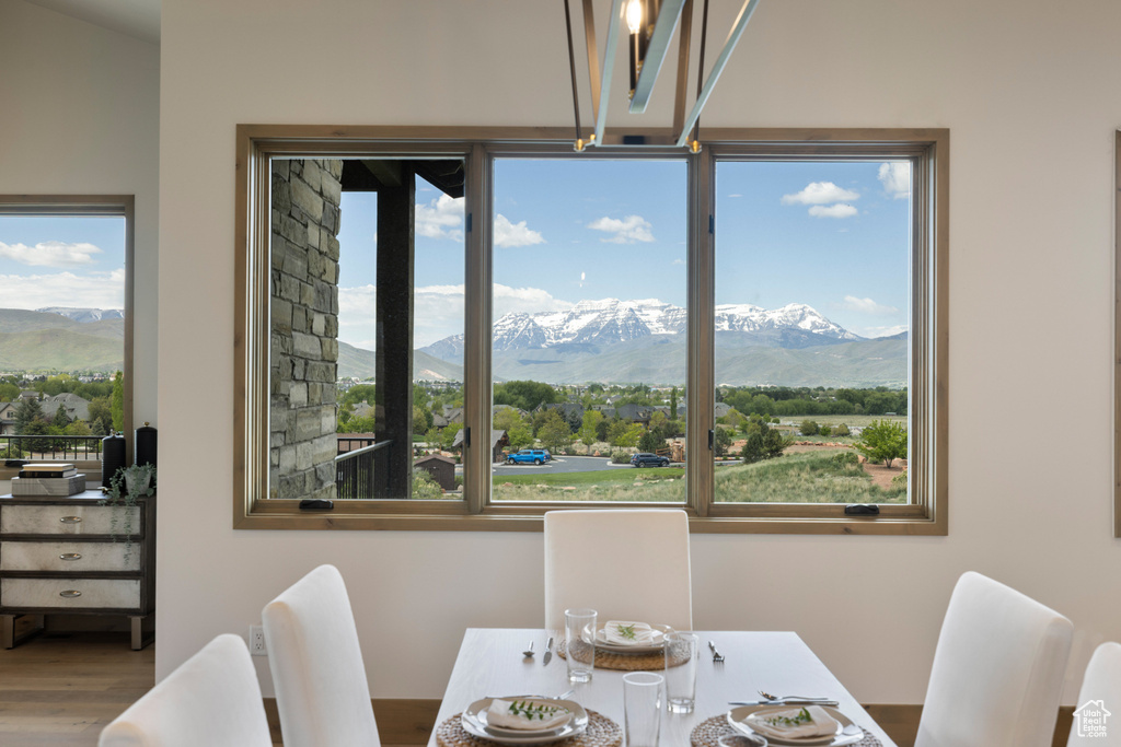 Dining area featuring a mountain view and wood finished floors