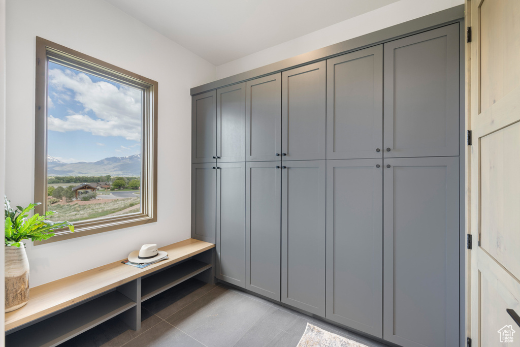 Mudroom with a mountain view and light tile patterned floors