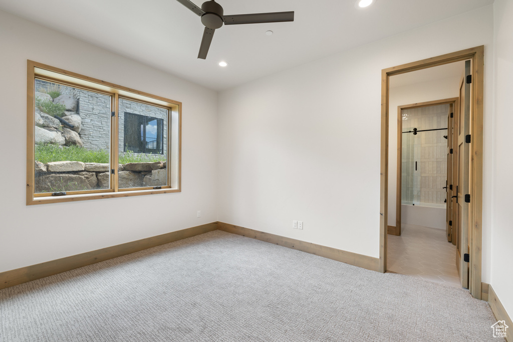 Carpeted spare room with ceiling fan, recessed lighting, and baseboards