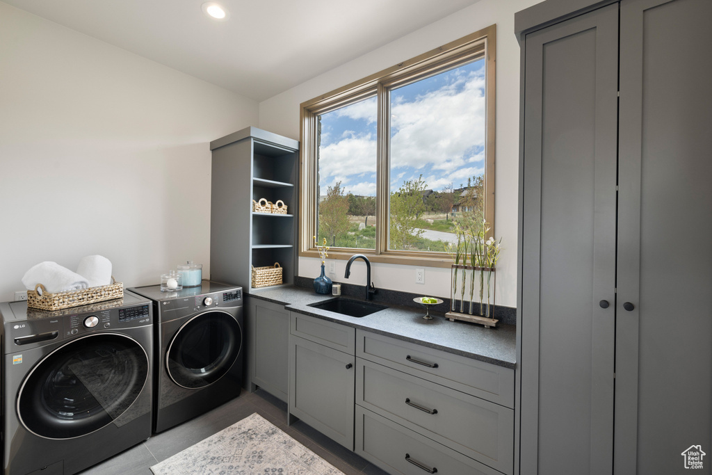 Laundry room with washing machine and dryer and cabinet space