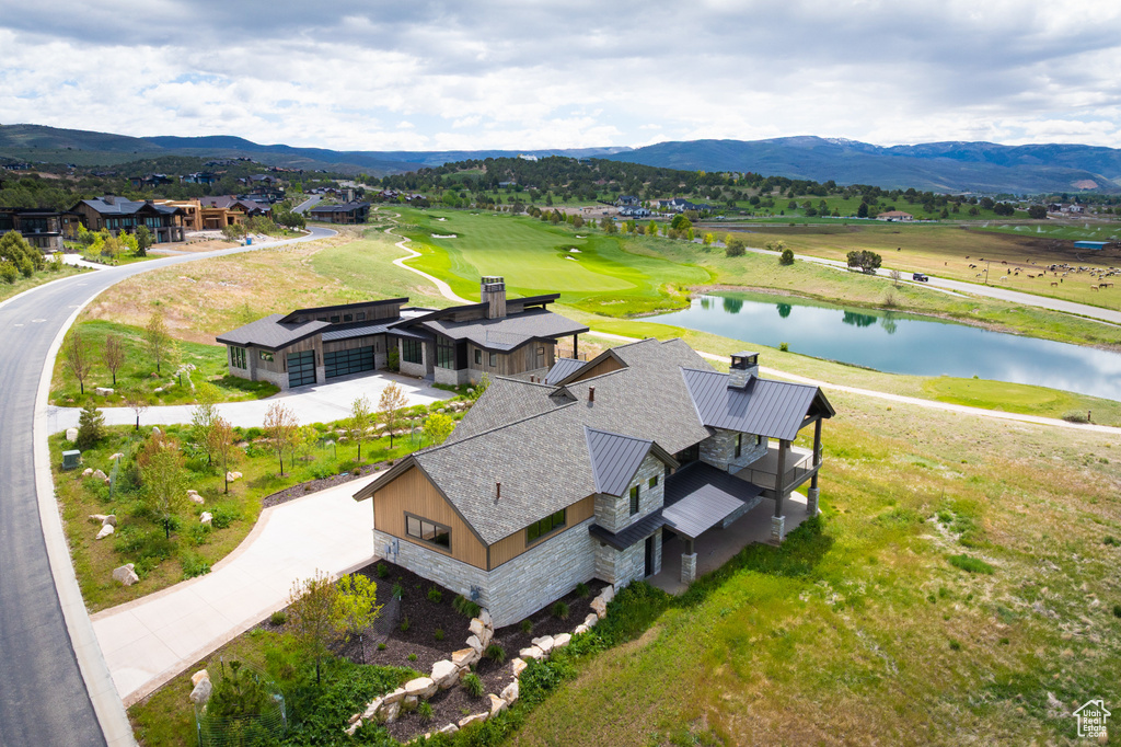 Aerial view of a water and mountain view and a golf course