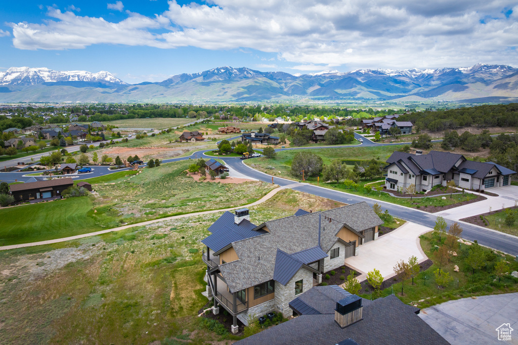 Aerial view of residential area with a mountainous background